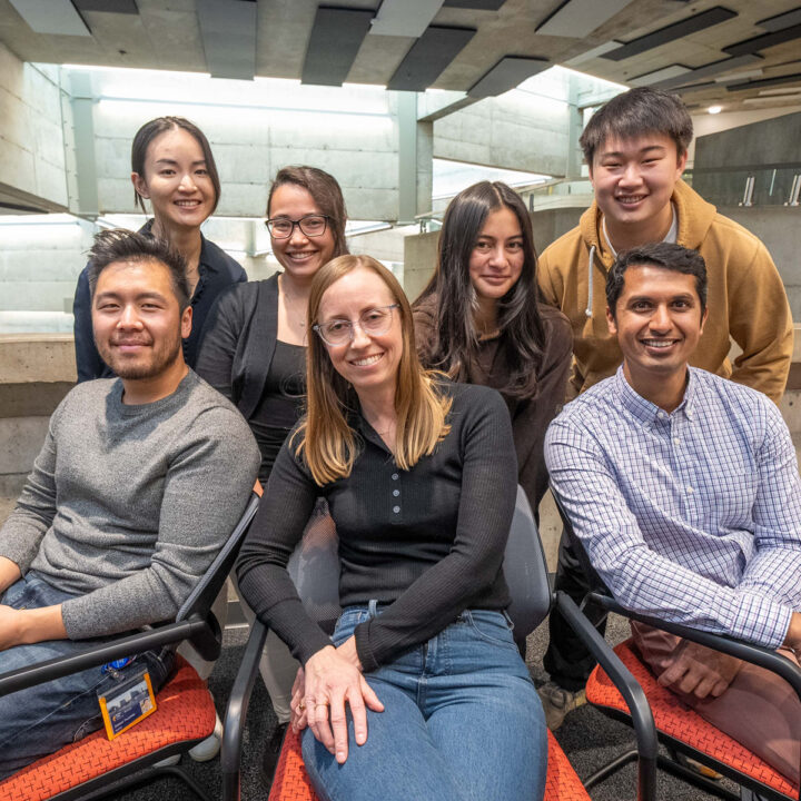A group shot of seven smiling members of a startup tenant company