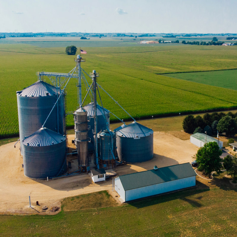 A corn farm with large silo