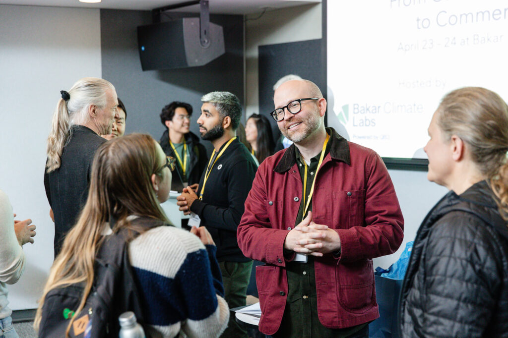 Attendees ask questions of the speakers following a panel at the AI x Climate Symposium